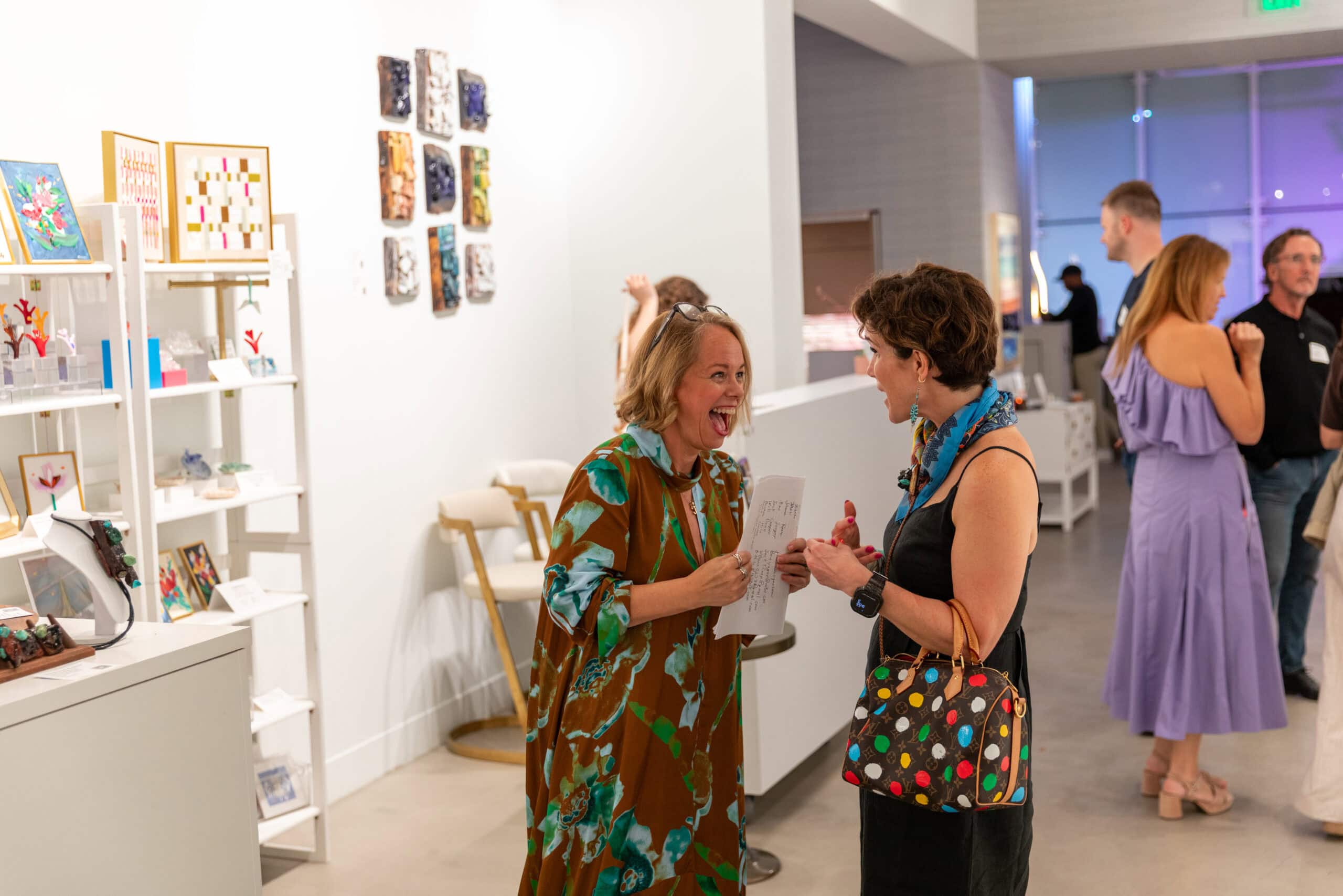 Joanne Grobbelaar, resilience architect, laughing at ALG Fine Art. The Long Journey Home Show opening.